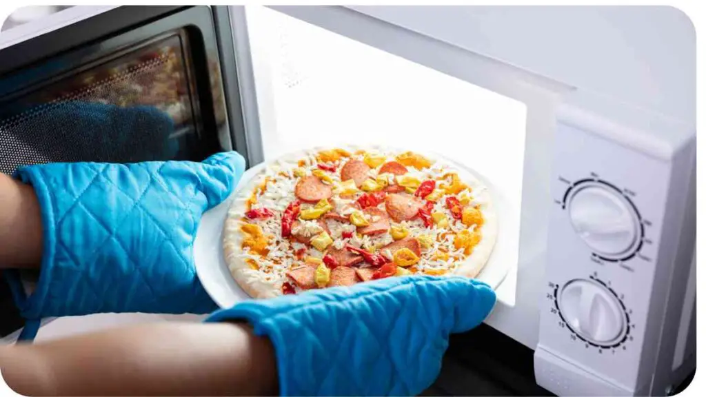 a person holding a plate with a pizza on it