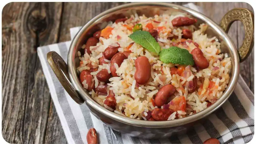 red beans and rice in a bowl on a wooden table